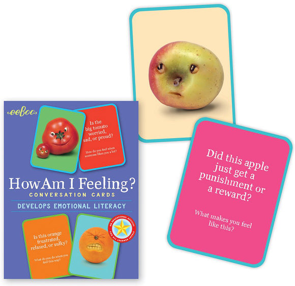 How Am I Feeling? conversation cards by Eeboo feature colorful cards depicting expressive fruits with asking prompts about emotions. The box showcases various facial expressions on fruits like tomatoes and apples, encouraging playful discussions about feelings.