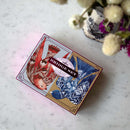 Eeboo's Bridge Playing Cards featuring Malin's Birds. The beautifully illustrated box showcases two decks of cards, one with red and the other with blue bird designs surrounded by floral accents. Ideal for classic card games.