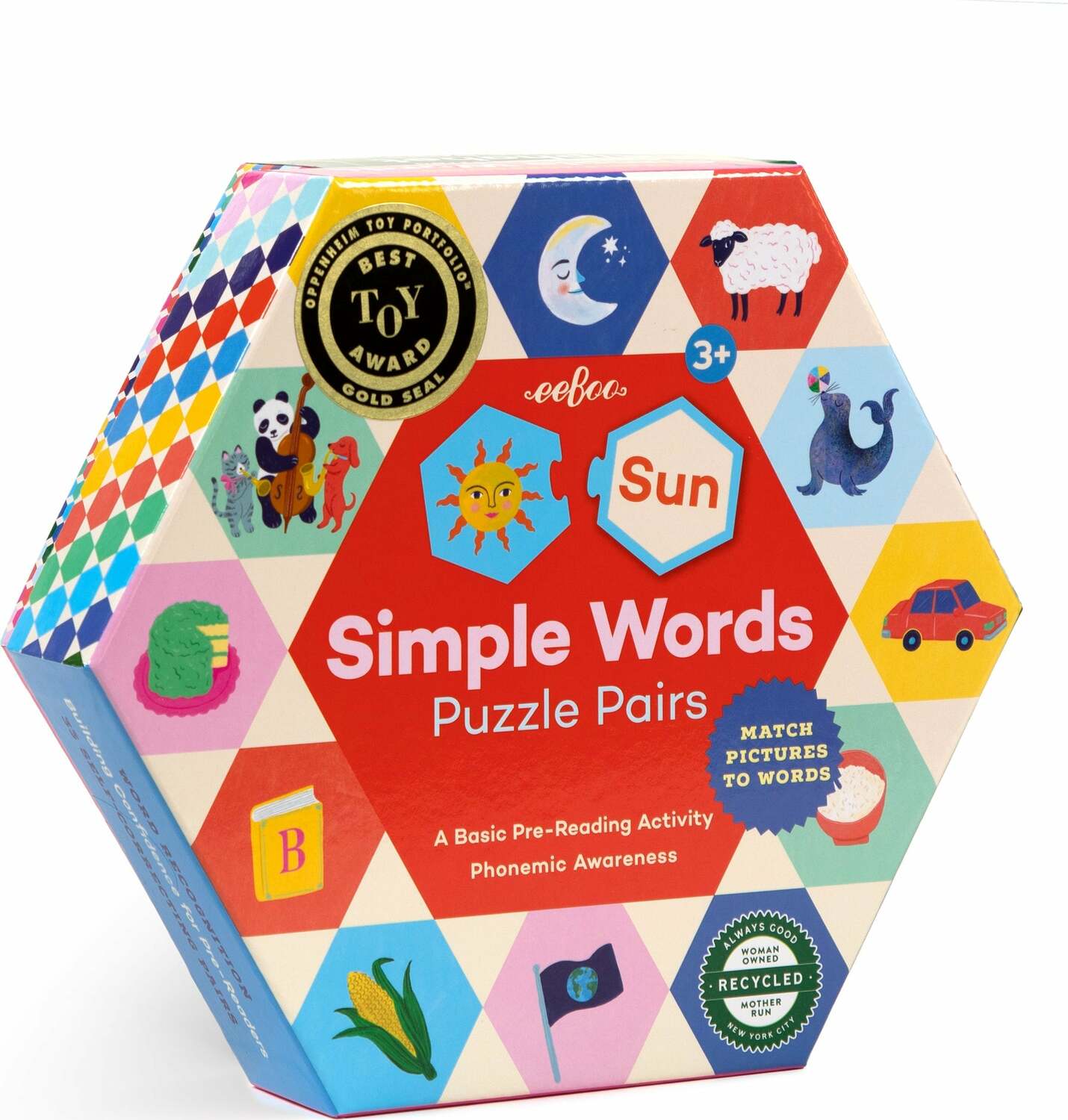 The Simple Words Hexagon Puzzle by Eeboo features colorful illustrations and words, designed for children aged 3 and up. The hexagonal box showcases various playful images including animals, objects, and a sun symbol. It's an engaging pre-reading activity for phonemic awareness, encouraging children to match pictures with words for a fun learning experience.