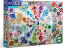 Eeboo Love of Crystal & Gems 100-piece jigsaw puzzle featuring a vibrant assortment of various crystals and gems arranged in a colorful design. The box includes a detailed illustration of gemstones such as Amethyst, Lapis Lazuli, Citrine, and Rose Quartz, along with their corresponding names. Perfect for ages 5 and up, this puzzle encourages learning and creativity while showcasing the beauty of gemstones.