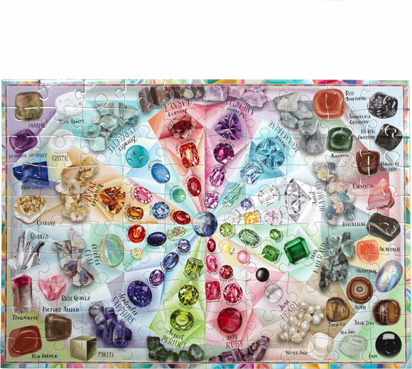 A colorful 100-piece jigsaw puzzle titled 'Love of Crystal & Gems' by Eeboo. Features various gems and crystals arranged in a vibrant, circular design, labeled with names like Citrine, Quartz, and Ruby.