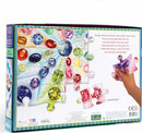 Love of Crystal & Gems 100-piece jigsaw puzzle by Eeboo, featuring colorful illustrations of various crystals and gems. The box displays vibrant gem designs and an encouraging poem about jewels. A hand reaches to place a puzzle piece, with a focus on engaging and educational imagery.