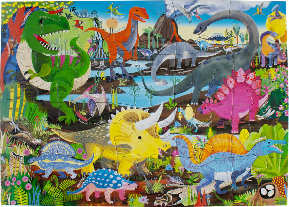 Colorful jigsaw puzzle titled 'Dinosaur Land' by Eeboo featuring various dinosaurs like T-Rex, Stegosaurus, and more, surrounded by a lush prehistoric landscape with trees and a volcano in the background.