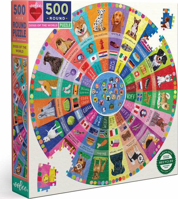 The Dogs of the World Round Puzzle by Eeboo features 500 colorful pieces arranged in a circle, showcasing various dog breeds and their names from around the globe. The vibrant design highlights distinct dog illustrations and flags representing different countries. The puzzle is packaged in a sturdy box, perfect for family fun and educational play.