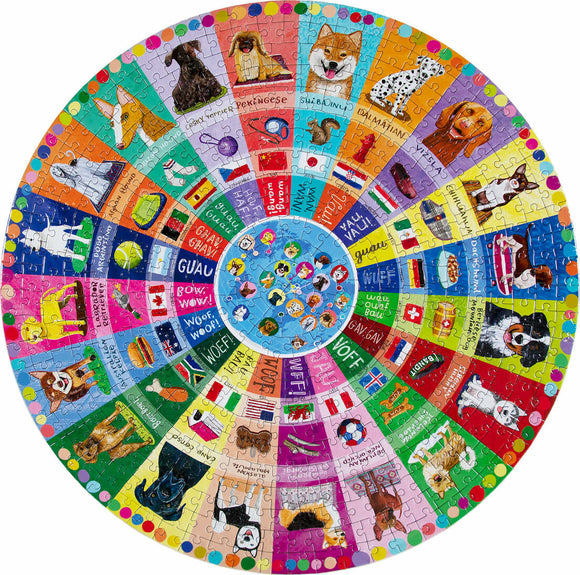 This vibrant round jigsaw puzzle features an array of illustrated dogs from around the world, each represented in their unique colors and styles. The circular design showcases various breeds, each accompanied by playful graphics and text in multiple languages depicting their barks. The colorful segments include backgrounds featuring flags, toys, and themed elements, making it not only a fun puzzle but also an educational experience about different dog breeds.