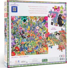 Eeboo's Garden of Eden jigsaw puzzle box featuring vibrant artwork of birds, flowers, and various creatures. The box dimensions are 23 x 23 inches, showcasing colorful illustrations that highlight the beauty and diversity of nature. The packaging includes a glimpse of the actual puzzle piece size.