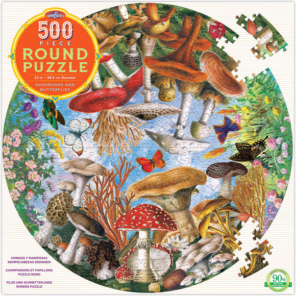 A beautifully illustrated 500-piece round jigsaw puzzle titled "Mushrooms and Butterflies" by eeBoo. The puzzle features a vibrant scene filled with various mushrooms and colorful butterflies, surrounded by flowers and greenery. It measures 23 inches in diameter and showcases intricate details and a rich color palette, perfect for nature lovers and puzzle enthusiasts.