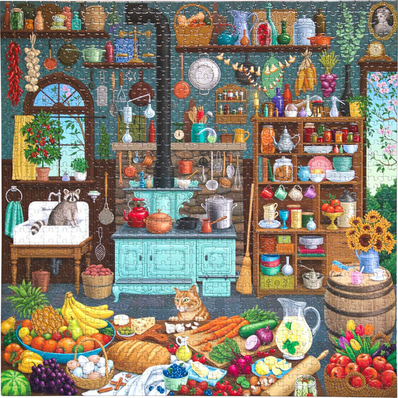 The Alchemist's Kitchen 1000-piece jigsaw puzzle by Eeboo features a vibrant, cozy kitchen scene filled with colorful fruits, vegetables, and kitchenware. A raccoon and a cat are playfully positioned in the foreground, while shelves are adorned with jars, pots, and plants. The background showcases a window with a view of blooming flowers, enhancing the enchanting atmosphere.