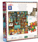 The Alchemist's Kitchen jigsaw puzzle featuring a colorful and detailed illustration of a kitchen filled with fruits, vegetables, pots, and whimsical characters such as raccoons. The box displays the title and puzzle specifications.