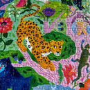 A vibrant 1000-piece jigsaw puzzle titled 'Life in a Tree' by Eeboo featuring a colorful and playful illustration of a spotted leopard, lush greenery, flowers, animals, and whimsical characters. The pieces are interlocked, showcasing the artwork's intricate details and vivid colors.