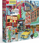 Colorful 1000-piece jigsaw puzzle titled 'New York City Life' by Eeboo. The image depicts a lively street scene in NYC, featuring iconic landmarks, diverse characters, street vendors, and vibrant shops, all set against a backdrop of the Statue of Liberty and skyscrapers.