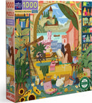 Eeboo's 'Reading & Relaxing' jigsaw puzzle featuring a cozy indoor scene adorned with a woman reading by a window. The room is filled with plants, books, and playful cats, creating a serene and inviting atmosphere. The colorful illustration depicts a vibrant landscape outside, enhancing the tranquil vibe of relaxation and enjoyment.