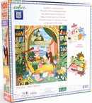 Eeboo Reading & Relaxing jigsaw puzzle featuring a serene scene with a woman reading in a cozy setting adorned with books, plants, and candles. The vibrantly illustrated box displays a picturesque background of colorful buildings and nature, along with sample puzzle pieces showcasing various colors and shapes. Puzzle dimensions are 23 x 23 inches, depicting a tranquil atmosphere perfect for relaxation.