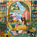 A vibrant jigsaw puzzle titled 'Reading & Relaxing' by Eeboo depicts a serene indoor scene. A woman sits at a table, reading a book with a cat beside her, surrounded by plants, books, and candles. A telescope and picturesque view of a castle over a lake enhance the tranquil atmosphere. Colorful shelves filled with decorative items and various plants create a cozy environment, perfect for relaxation and leisure.