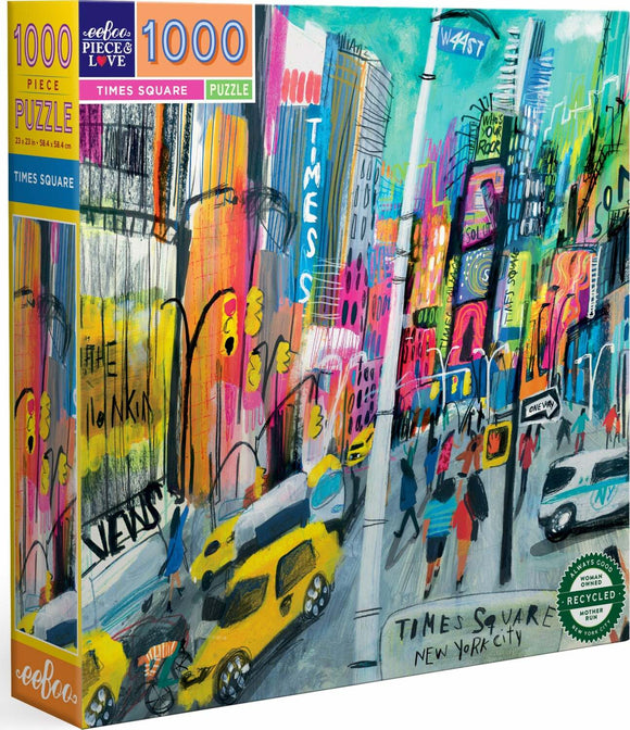 eeboo Times Square jigsaw puzzle featuring a vibrant and colorful illustration of New York City's iconic Times Square. The artwork depicts bustling streets filled with yellow taxis, pedestrians, bright signage, and lively buildings. This 1000-piece puzzle measures 23 x 23 inches and is designed for puzzle enthusiasts of all ages.