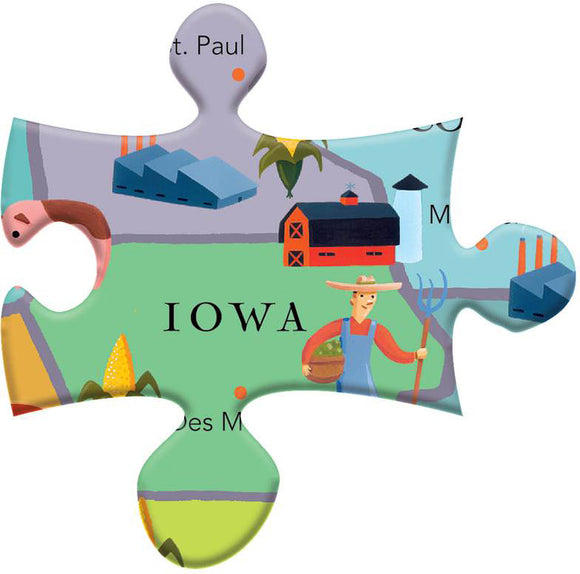 Close-up of a jigsaw puzzle piece featuring a colorful illustration depicting the state of Iowa. The artwork showcases a farmer holding a basket, a traditional red barn, and green fields with crops, capturing a vibrant agricultural landscape.