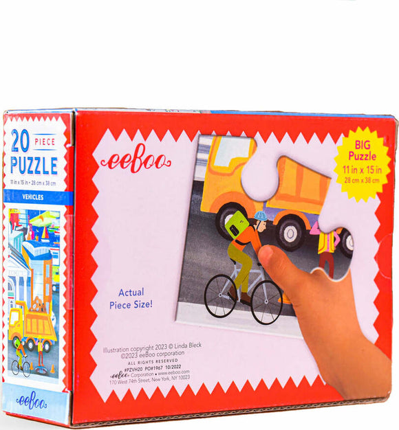 The Eeboo Vehicles 20 Piece Puzzle features colorful illustrations of various vehicles, including a bicycle, a truck, and children engaging with them. The puzzle box prominently displays the title and emphasizes that it measures 11 inches by 15 inches. A hand is shown fitting a piece into the puzzle, showcasing the actual piece size.