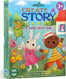 Colorful packaging of Eeboo's 'Create a Story Cards: A Very Busy Day'. Features whimsical characters like a rabbit, bear, and a green figure in a hat, alongside flowers and trees. Ideal for encouraging storytelling and creativity in children aged 3 and up.