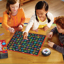 Three children playing Robot Face Race game by Educational Insights. The brightly colored game board features various robot faces, and children are placing tokens on the board while engaging in the game.