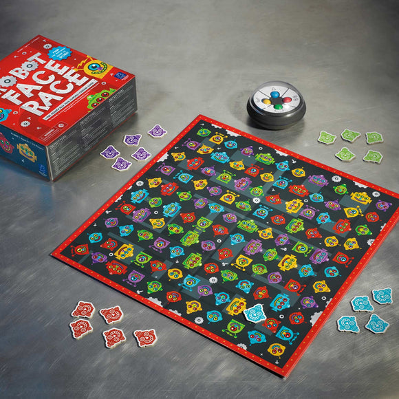 Robot Face Race game by Educational Insights displayed on a steel table. The vibrant game board features colorful robot faces in various designs arranged in a grid. Nearby are game pieces in different shapes and colors, along with the game box.