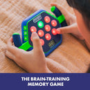 A child playing with the BrainBolt Boost memory game. The device features vibrant red and green buttons and a digital timer, designed to enhance memory skills. The user is pressing the colorful buttons while focused on the screen displaying a countdown.