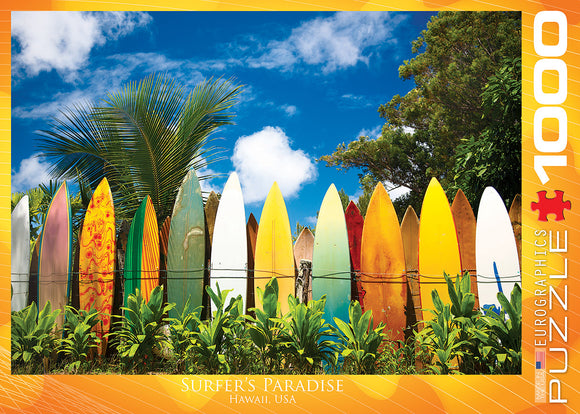 Surfer's Paradise jigsaw puzzle features a vibrant scene of colorful surfboards lined against a tropical backdrop of greenery and blue skies, highlighting the essence of Hawaii. Ideal for puzzle enthusiasts and beach lovers, this 1000-piece puzzle by Eurographics captures the spirit of surfing culture.