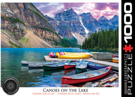 A scenic jigsaw puzzle featuring canoes lined up on a tranquil lake surrounded by majestic mountains and lush greenery. The vibrant colors of the canoes and the reflection on the water create a calming view, ideal for puzzle enthusiasts and nature lovers alike.