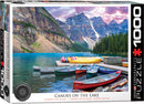 A colorful jigsaw puzzle box featuring a serene image of canoes docked by a pristine lake surrounded by majestic mountains and lush forests under a beautiful sky.
