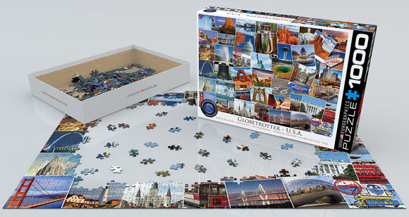 The USA - Globetrotter jigsaw puzzle by Eurographics features vibrant images of iconic American landmarks. The box is partially open, revealing the colorful puzzle pieces scattered on a smooth surface, with some pieces already placed in the border of the puzzle layout.