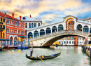 Eurographics jigsaw puzzle featuring the iconic Rialto Bridge in Venice. The image showcases the stunning architecture of the bridge, colorful Venetian buildings, and a gondola navigating the canal, with a beautiful sunset backdrop.
