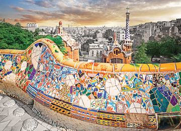 A vibrant jigsaw puzzle depicting the colorful architecture of Park Güell in Barcelona. The image features the iconic mosaic-covered bench, with patterns of various colors, surrounded by beautiful greenery and a distant city skyline. The puzzle showcases the artistic style of Gaudí, making it a delightful challenge for puzzle enthusiasts.