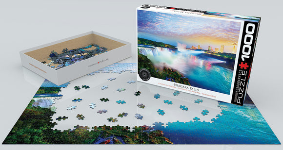 A Eurographics jigsaw puzzle featuring a vibrant image of Niagara Falls. The puzzle box is shown next to a partially assembled image, with colorful pieces scattered around. The scene captures the majestic waterfalls amidst a backdrop of a colorful sky and city skyline, highlighting the beauty of nature.