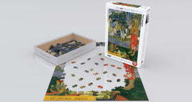 A 1000-piece jigsaw puzzle featuring Paul Gauguin's painting 'La Orana Maria' (Hail Mary). The box is partially open with some pieces scattered, showing vibrant colors and intricate details of tropical scenery and human figures. The puzzle is set on a flat surface, showcasing the beginning stages of assembly.