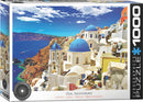 Eurographics jigsaw puzzle titled 'Oia, Santorini, Greece' featuring a vibrant coastal landscape with iconic white buildings and blue domes under a bright sky. The puzzle contains 1000 pieces, perfect for capturing the beauty of Santorini.