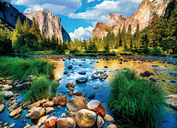 Yosemite National Park Jigsaw Puzzle by Eurographics featuring a scenic view of El Capitan and Yosemite Valley, surrounded by lush greenery and vibrant blue skies. Perfect for nature lovers and puzzle enthusiasts, this 1000-piece jigsaw captures the beauty of California's iconic national park.