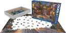 A jigsaw puzzle titled 'The French Walkway' by Dominic Davison, showing a picturesque street scene with vibrant colors and charming architecture. The box is displayed next to the puzzle with pieces scattered on a table. The puzzle features 1000 pieces and highlights outdoor cafes and cobblestone pathways.