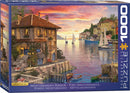 Eurographics jigsaw puzzle titled 'Mediterranean Harbor' by Dominic Davison. The puzzle features a serene coastal scene with charming Mediterranean architecture, colorful boats, and a sunset reflecting on the water. Perfect for puzzle enthusiasts who love scenic landscapes.
