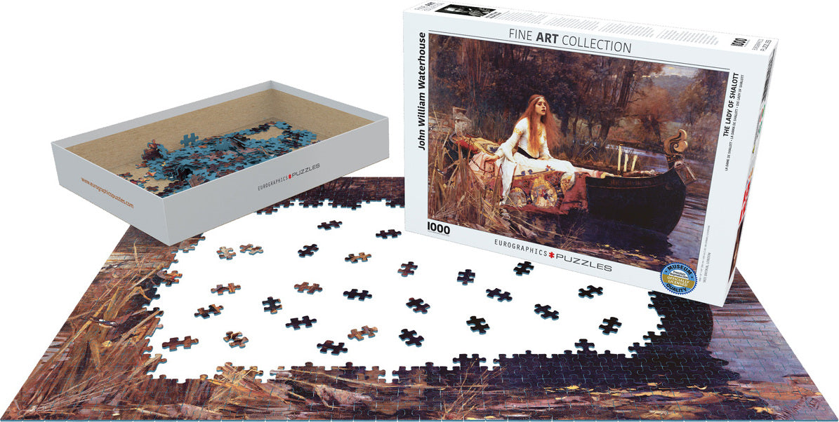 The Lady of Shalott jigsaw puzzle by John William Waterhouse, featuring a partially completed 1000-piece design on a table, with pieces in a box beside it. The box showcases the artwork depicting a woman in a boat surrounded by a lush landscape.