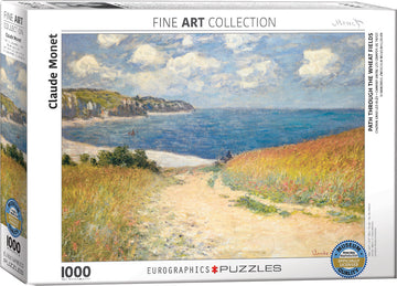 A jigsaw puzzle of Claude Monet's 'Path through the Wheat Fields' depicting a scenic pathway leading through vibrant golden fields toward a tranquil blue sea under a cloudy sky. The puzzle features 1000 pieces and is part of Eurographics' Fine Art Collection, showcasing museum-quality artwork.