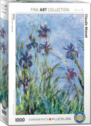 A jigsaw puzzle featuring a detail from 'Irises' by Claude Monet. The box showcases a vibrant and textured impressionist painting of irises against a soft blue background, highlighting the flowers in shades of purple and red surrounded by green grass.