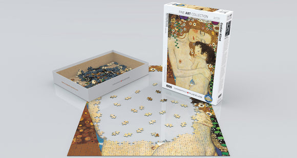 The 'Mother and Child (Detail)' jigsaw puzzle by Eurographics features an image of a mother and child, derived from Gustav Klimt's artwork. The puzzle includes numerous colorful pieces, with some already placed on a surface. The box is designed with artistic details reflecting the puzzle image and contains 1000 pieces, making it ideal for art lovers and puzzle enthusiasts.
