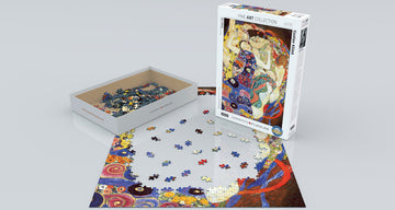 The Virgin jigsaw puzzle by Gustav Klimt, created by Eurographics. The image shows the box containing 1000 pieces, with some pieces scattered and the puzzle partially assembled, featuring Klimt's iconic art style.