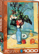 Jigsaw puzzle featuring Paul Cezanne's 'Blue Vase', depicting a blue vase with flowers on a table alongside fruits. The packaging shows vibrant colors and includes the title in multiple languages.