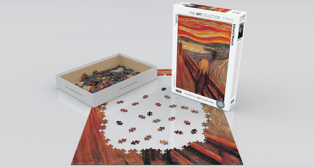 The Scream by Edvard Munch jigsaw puzzle, featuring a colorful, iconic artwork. The image shows puzzle pieces scattered around the partially completed puzzle, with the box in the background displaying the painting's vibrant hues.