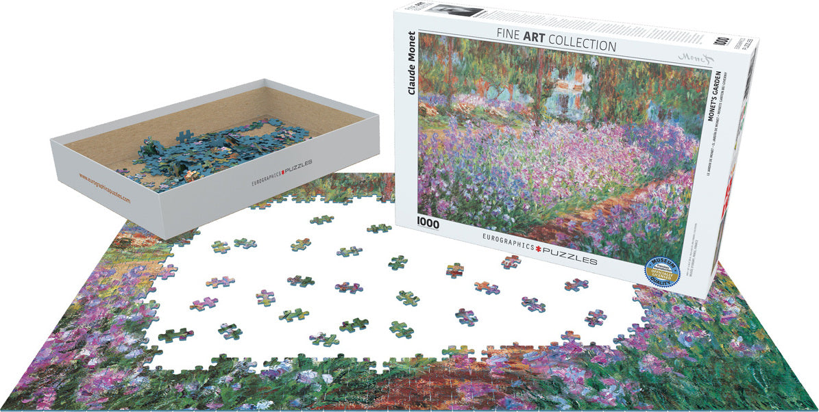 A jigsaw puzzle featuring Monet's Garden by Claude Monet. The packaging shows a vibrant depiction of a garden scene by Monet, with pieces scattered on a table and a partially completed image visible. The puzzle consists of 1000 pieces and comes in a sturdy box marked with the Eurographics brand.