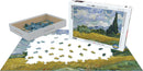 Eurographics Wheat Field with Cypresses jigsaw puzzle featuring a vibrant landscape by Vincent van Gogh. The image depicts scattered puzzle pieces alongside the box containing 1000 pieces, showcasing details of the artwork.