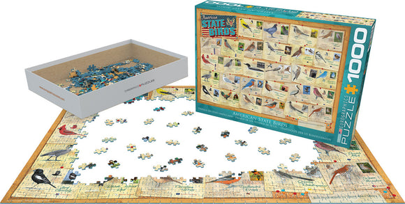Eurographics American State Birds jigsaw puzzle featuring a colorful design of various state birds from the U.S. The puzzle, consisting of 1000 pieces, is shown partially completed. A white box with many loose pieces is placed beside the puzzle.