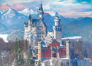 Neuschwanstein Castle in Winter jigsaw puzzle by Eurographics. The image depicts a breathtaking view of the iconic castle surrounded by snowy mountains and a serene winter landscape, showcasing intricate architecture and vibrant colors.
