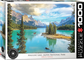 Eurographics jigsaw puzzle featuring Maligne Lake in Jasper National Park, Alberta. The vibrant image depicts calm turquoise waters surrounded by majestic mountains and pine trees, with a kayak on the lake.