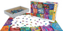 A vibrant 1000-piece jigsaw puzzle titled 'Indian Pillows' by Eurographics. The box features colorful designs of intricate Indian pillow covers, with scattered puzzle pieces displayed around the partially completed puzzle. The puzzle showcases a rich array of colors and patterns, reflecting traditional Indian textile artistry.